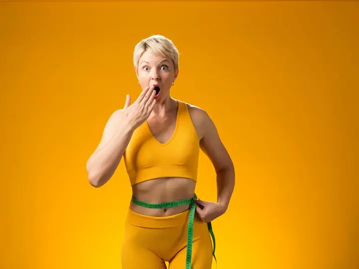 fitness-woman-with-measure-tape-isolated-yellow-background-weight-loss-healthcare-concept Fogyás beindítása – 10 lépéssel! Testsúlycsökkentés 