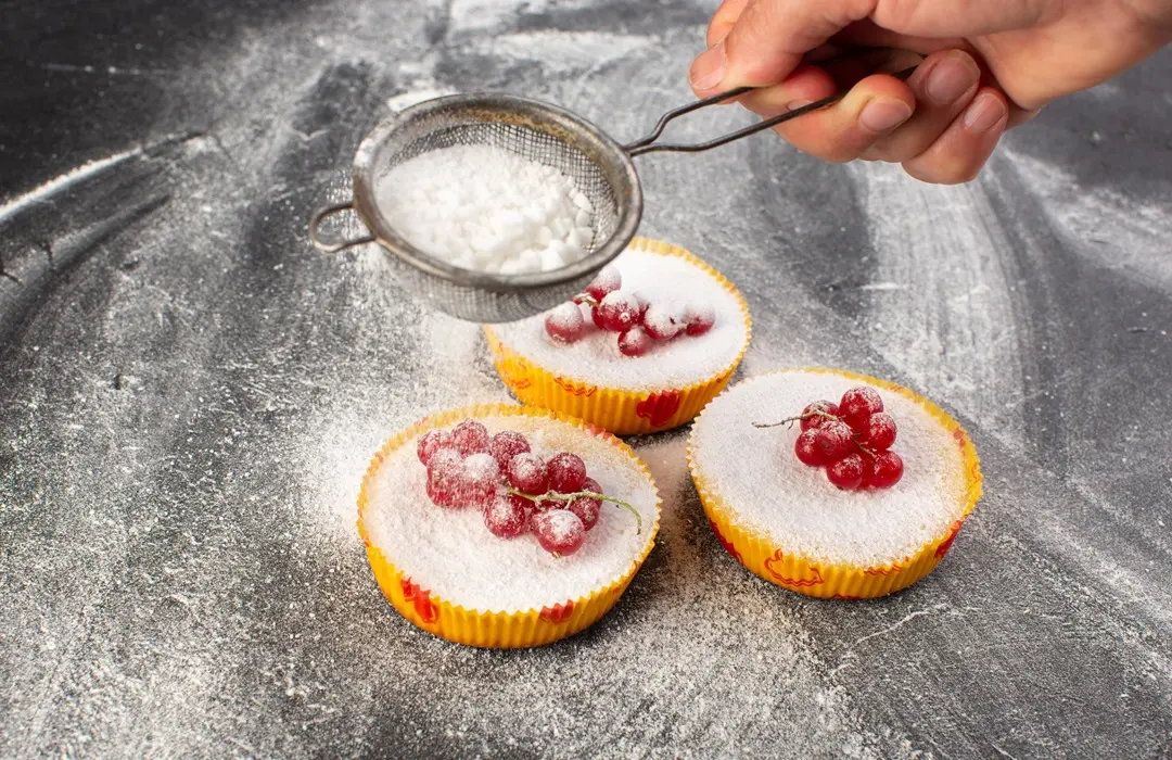 top-view-delicious-cranberry-cakes-baked-yummy-getting-sugar-powder-with-red-cranberries-top-grey-desk-cake-biscuit-sugar-sweet Édesítőszerek: amit tudni érdemes 2025-ben Emésztés 