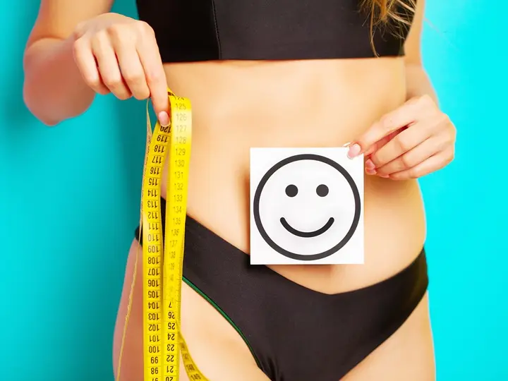 woman-with-sporty-figure-measures-size-her-waist Fogyás beindítása – 10 lépéssel! Testsúlycsökkentés 