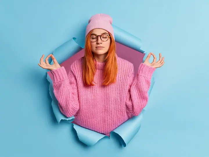 young-calm-relaxed-woman-holds-hands-yoga-gesture-keeps-eyes-closed-meditates-indoor-breathes-deeply-meditates-indoor Magas kortizolszint csökkentése természetesen Mentális egészség 
